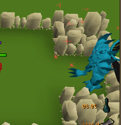 The Blue Titan in its rocky arena, with red ground markers showing danger zones and a percentage readout in the corner.